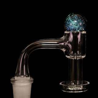 Dichro glass 22 mm bubble carb cap in turquoise, on a quartz banger