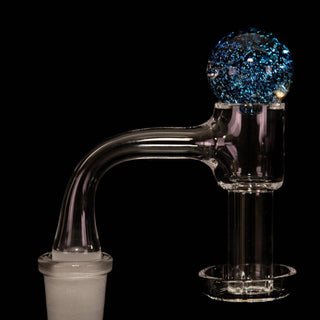 Dichro glass 25 mm bubble carb cap in blue, on a quartz banger