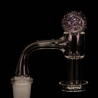 Dichro glass 25 mm bubble carb cap in purple, on a quartz banger